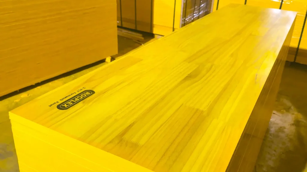 Stacked ROCPLEX Three Ply Shuttering Panels - Ready for Use ROCPLEX stacked three ply shuttering panels with brand labeling for easy identification.